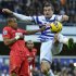 Queens Park Rangers' Ryan Nelsen challenges for the ball with Southampton's Nathaniel Clyne during their English Premier League soccer match at Loftus Road in London