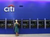 A woman uses an ATM inside a Citi bank branch in New York