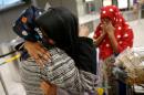 Abdishakur is greeted by her mother Warsma at Washington Dulles International Airport in Chantilly, Virginia