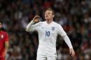England's Wayne Rooney shouts instructions to a teammate during the international friendly soccer match between England and Peru at Wembley Stadium in London, Friday, May 30, 2014. (AP Photo/Matt Dunham)