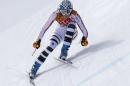 Germany's Maria Hoefl-Riesch makes a turn during the downhill portion of the women's supercombined at the Sochi 2014 Winter Olympics, Monday, Feb. 10, 2014, in Krasnaya Polyana, Russia. (AP Photo/Luca Bruno)