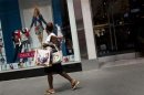 Woman walks past an Aeropostale store in Times Square in New York
