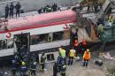 Rescue workers evacuate the body of a victim following a terror bombing on a train at the Atocha railway station in Madrid on March 11, 2004
