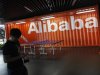 An employee walks past a logo of Alibaba (China) Technology Co. Ltd during a media tour organised by government officials at its headquarters on the outskirts of Hangzhou
