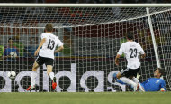 Germany's Mario Gomez, second right, scores a goal during the Euro 2012 soccer championship Group B match between the Netherlands and Germany in Kharkiv, Ukraine, Wednesday, June 13, 2012. (AP Photo/Frank Augstein)