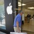 In this Thursday, July 19, 2012, photo, An Apple customer returns an Apple 21.5-inch iMac computer to an Apple store in Palo Alto, Calif. Apple Inc. reports quarterly financial results after the market closes on Tuesday, July 24.  (AP Photo/Paul Sakuma)