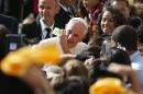 Pope Francis poses for a selfie with a student as he arrives at Our Lady Queen of Angels School, Friday, Sept. 25, 2015, in New York. (AP Photo/Jason DeCrow)
