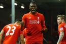 Liverpool's striker Christian Benteke (C) celebrates scoring the opening goal during the English Premier League football match between Liverpool and Leicester City at the Anfield stadium in Liverpool, England on December 26, 2015