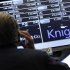 A trader stands by the post that trades Knight Capital on the floor of the New York Stock Exchange