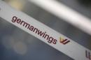 A barrier tape of German airline Lufthansa's low-cost carrier Germanwings is pictured at a closed gate of Berlin Tegel airport