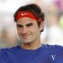 Roger Federer of Switzerland smiles while taking a break during practice at the BNP Paribas Open ATP tennis tournament in Indian Wells, California