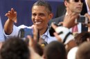 President Barack Obama greets supporters during a campaign stop Saturday, Aug. 18, 2012 in Rochester, N.H. (AP Photo/Jim Cole)