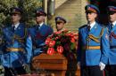 Members of a military honour guard stand next to the casket containing the remains of Jovanka Broz, the late widow of former Yugoslav communist leader Josip Broz Tito, during a funeral ceremony in Belgrade on October 26, 2013