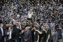 Michigan State players and coaches celebrate after they defeated Michigan 69-55 in an NCAA college basketball game in the championship of the Big Ten Conference tournament on Sunday, March 16, 2014, in Indianapolis. (AP Photo/Michael Conroy)