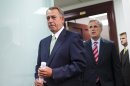Speaker of the House John Boehner, R-Ohio, and House Republican leaders emerge from a closed-door strategy session at the Capitol, Wednesday, Sept. 18, 2013. House GOP leaders are looking to reverse course and agree to tea party demands to try to use a vote this week on a must-pass temporary government funding bill to block implementation of President Barack Obama's health care law. Boehner is followed by House Majority Whip Kevin McCarthy, R-Calif. (AP Photo/J. Scott Applewhite)