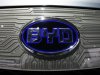 A BYD (Build Your Dreams) logo is seen on the front of an e6 electric vehicle during the press days for the North American International Auto show in Detroit