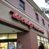 FILE -- In a Sept. 27, 2010 file photo shows a woman pushing a baby carriage past the entrance of a Walgreens pharmacy in Brookline, Mass.   Drugstore chain Walgreen Co. says it will spend $6.7 billion to buy a stake in health and beauty retailer Alliance Boots.   (AP Photo/Steven Senne, file)