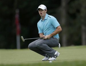 Northern Ireland's Rory McIlroy reacts after missing a birdie putt on the second hole during the final round of the 2013 PGA Championship golf tournament at Oak Hill Country Club in Rochester