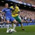 Norwich City's Leon Barnett (R) challenges Chelsea's Fernando Torres during their English Premier League soccer match in London