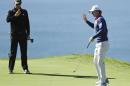 Brandt Snedeker, right, waves as Justin Rose lines up a putt on the second hole during the second round of the Farmers Insurance Open golf tournament on the South Course at Torrey Pines Golf Course on Friday, Jan. 27, 2017, in San Diego. (AP Photo/Chris Carlson)