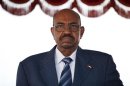 Sudanese President Omar Hassan al-Bashir stands for the national anthem on arrival at Bole International airport for the 21st Ordinary Session of the African Union in Addis Ababa