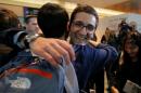 Behnam Partopour, a Worcester Polytechnic Institute student from Iran, is greeted by friends at Logan Airport after he cleared U.S. customs and immigration on an F1 student visa in Boston