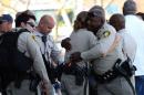 Las Vegas shooting: Search for motive after officers, shopper killed