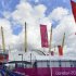 Olympics banners and flags are seen beside the North Greenwich Arena at Greenwich in London