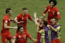 Belgium's Kevin De Bruyne, center right, celebrates scoring the opening goal during the World Cup round of 16 soccer match between Belgium and the USA at the Arena Fonte Nova in Salvador, Brazil, Tuesday, July 1, 2014. (AP Photo/Themba Hadebe)