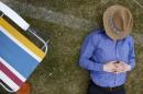 Man sleeps during final of Gold Cup British Open Polo Championship match at Cowdray Park