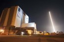 Photos: NASA rocket launch lights up night sky