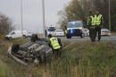 Surete du Quebec officer investigates an overturned vehicle in Saint-Jean-sur-Richelieu