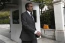 Greek PM Samaras walks towards his office in Athens shortly after arriving in Greece