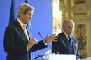 French Foreign Minister Laurent Fabius (R) listens as US Secretary of State John Kerry speaks during a joint press conference on March 7, 2015 in Paris