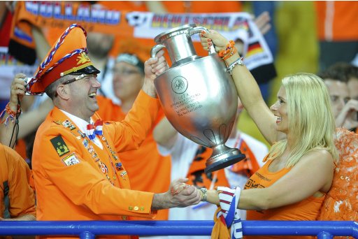 Netherlands' fans cheer before their Group B Euro 2012 soccer match against Germany at the Metalist stadium in Kharkiv