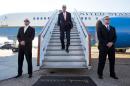 US Secretary of State John Kerry (C) arrives at Stansted Airport outside of London on May 14, 2014