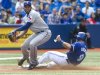 Toronto Blue Jays' Arencibia is out on the force out at third base as Texas Rangers' Garcia makes the play in their American League MLB baseball game in Toronto