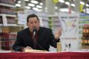 Handout Venezuela's President Hugo Chavez speaks during the opening of a state-run Bicentenario supermarket in Caracas