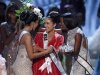 Miss USA Culpo is congratulated by Miss Teen USA West and Miss Universe 2011 Lopes during Miss Universe pageant in Las Vegas