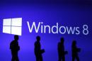 File photo of guests silhouetted at the launch event of Microsoft Windows 8 operating system in New York