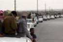 A funeral convoy carrying the bodies of four Islamist militants drives through Sheikh Zuweid, in the north of the Sinai peninsula