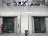 A woman leaves Belgian-French financial services group Dexia headquarters in Brussels