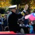 Crowds wave to Navy Capt. Jim Minta as he participates in the 31st annual Veterans Day Parade in downtown Atlanta, Saturday, Nov. 10, 2012. (AP Photo/David Tulis)