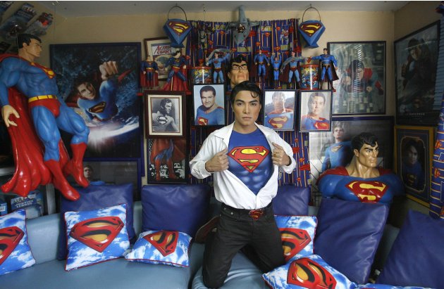 Herbert Chavez poses with his Superman memorabilia inside his house in Calamba Laguna, south of Manila