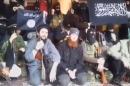 A still image taken on July 14, 2016 from an undated video posted on social media, shows Islamic State senior operative Abu Omar al-Shishani sitting with fighters in an unknown location