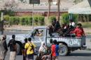 Loyalists of exiled Yemeni President Abedrabbo Mansour Hadi patrol a road in the western suburbs of the southern city of Aden on May 8, 2015