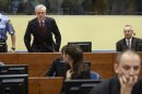 Simatovic and Stanisic sit in the courtroom prior to the Trial Chamber Judgement at the International Criminal Tribunal for the former Yugoslavia in the Hague