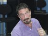 In this image released by Guatemala's National Police on Wednesday Dec. 5, 2012, software company founder John McAfee is pictured after being arrested for entering the country illegally Wednesday Dec. 5, 2012 in Guatemala City. The anti-virus guru was detained at a hotel in an upscale Guatemala City neighborhood with the help of Interpol agents hours after he said he would seek asylum in the Central American country. (AP Photo/Guatemala's National Police)