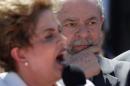 Brazil's former President Luiz Inacio Lula da Silva listens as suspended President Dilma Rousseff addresses supporters, after the Brazilian Senate voted to impeach her for breaking budget laws, at Planalto Palace in Brasilia