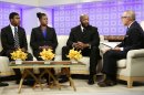 In this image released by NBC, parents of Trayvon Martin, Sybrina Fulton, second left, and Tracy Martin, second right, appear on the "Today" show with Fulton's other son Jahvaris Fulton, left, and co-host Matt Lauer in New York. Martin's parents plan to participate in separate vigils on Saturday. Sabrina Fulton and Jahvaris Fulton will join Al Sharpton outside New York Police Department headquarters while Tracy Martin is set to be at a similar event at a federal courthouse in Miami. (AP Photo/NBC, Peter Kramer)